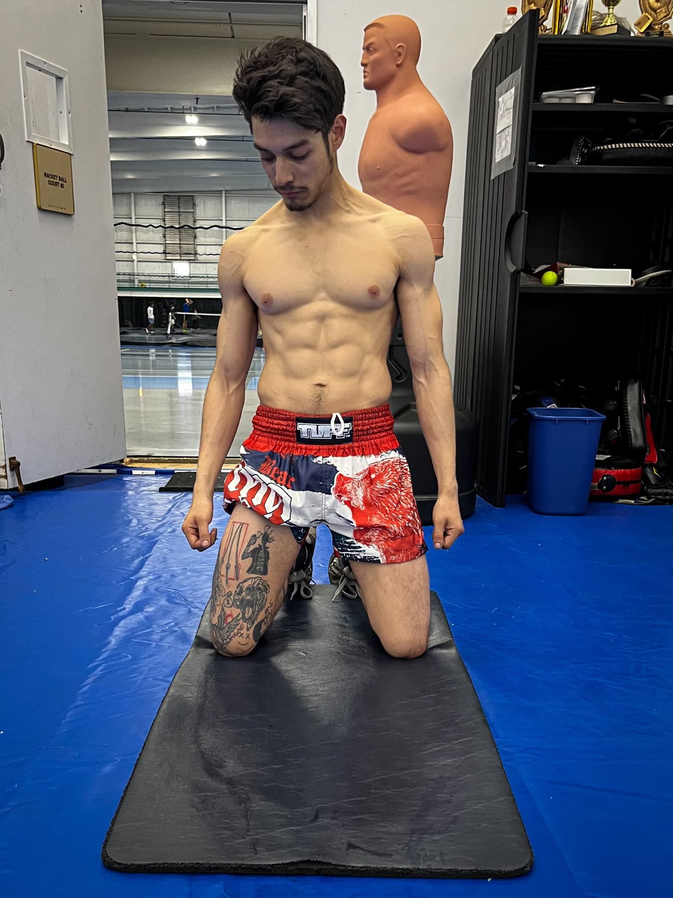 Joseles kneeling after Muay Thai training